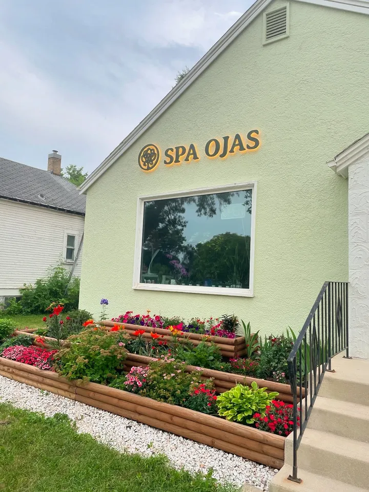 The SPA OJAS sign on the front of the building