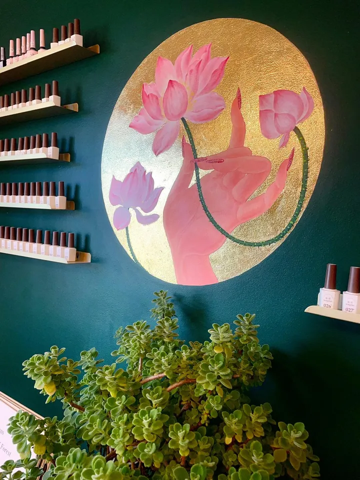 A close view of the lotus painting above a plant